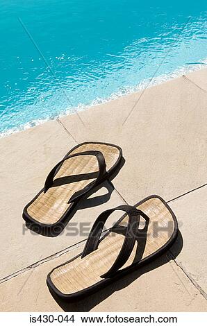 Picture - Flip flops by the pool. Fotosearch