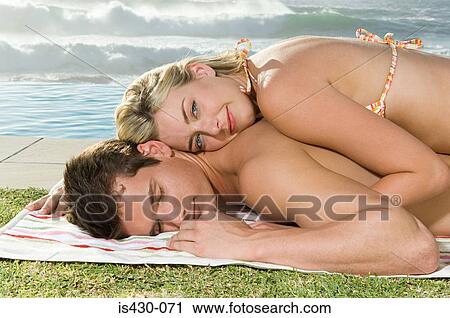 Woman lying on her boyfriend View Large Photo Image Stock Image - Woman lying on her boyfriend. Fotosearch