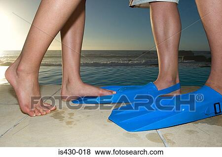 Woman with man in flippers View Large Photo Image Stock Photo - Woman with man in flippers. Fotosearch