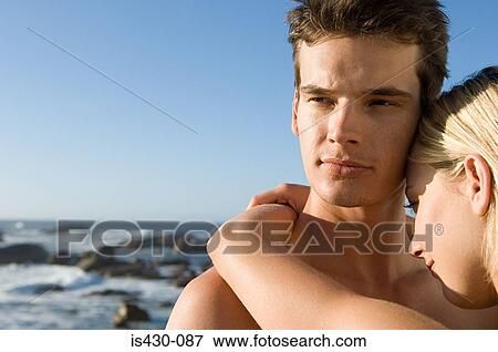 Stock Photo - Young couple at the coast. Fotosearch