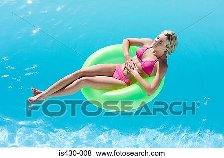Young woman in pool View Large Photo Image Stock Photo - Young woman in pool. Fotosearch