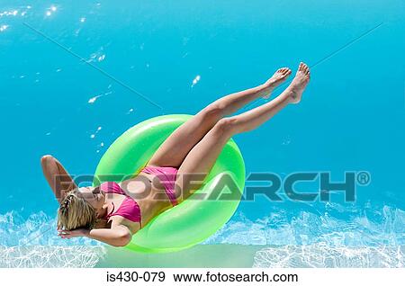 Stock Photo - Young woman in pool. Fotosearch