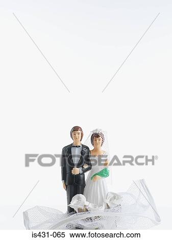 Stock Photography - Bride and groom wedding cake decoration. Fotosearch