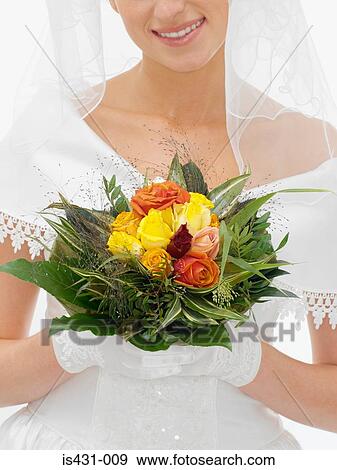 Stock Photo - Bride holding bouquet. Fotosearch