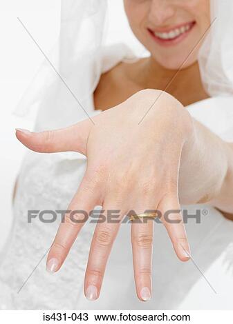 Bride showing her wedding ring View Large Photo Image Stock Image - Bride showing her wedding ring. Fotosearch