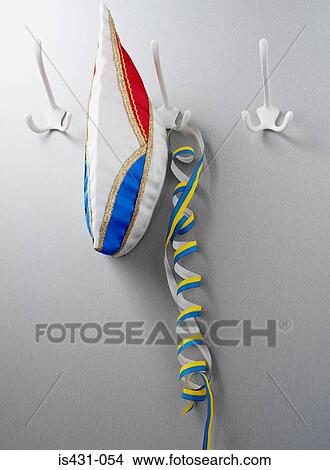 Carnival hat and streamer on hooks View Large Photo Image Picture - Carnival hat and streamer on hooks. Fotosearch