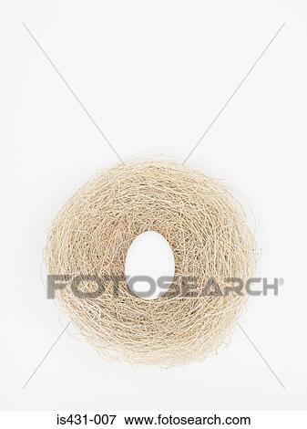 Stock Photo - Egg in a nest. Fotosearch