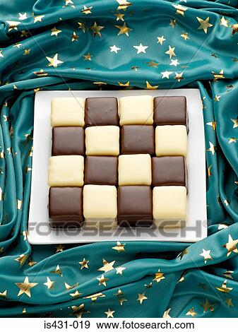 Festive chocolate coated cakes View Large Photo Image Stock Photo - Festive chocolate coated cakes. Fotosearch