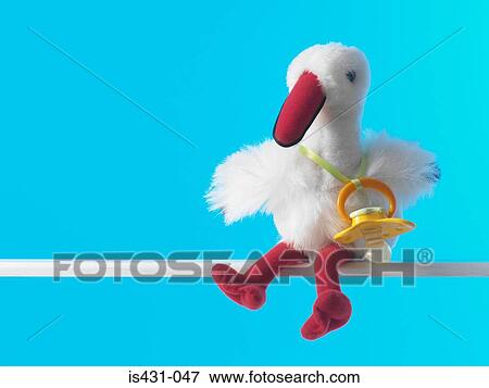 Stork toy with pacifier View Large Photo Image Stock Photo - Stork toy with pacifier. Fotosearch