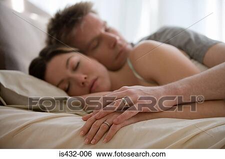 Stock Photograph - Couple sleeping. Fotosearch