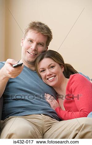 Couple watching television View Large Photo Image Stock Photo - Couple watching television. Fotosearch