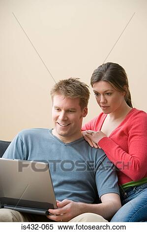Husband and wife with laptop View Large Photo Image Stock Photography - Husband and wife with laptop. Fotosearch