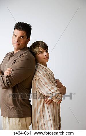 Father and son back to back View Large Photo Image Stock Image - Father and son back to back. Fotosearch
