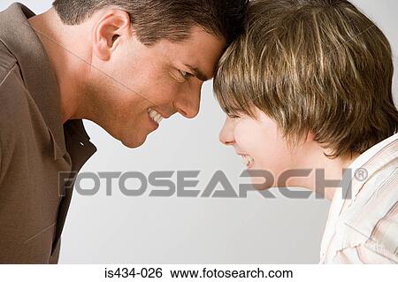 Father and son face to face View Large Photo Image Stock Photograph - Father and son face to face. Fotosearch