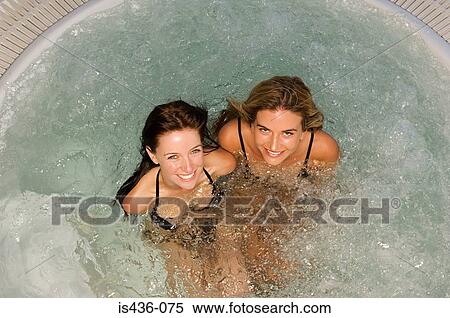 Two women in a jacuzzi View Large Photo Image Stock Photography - Two women in a jacuzzi. Fotosearch