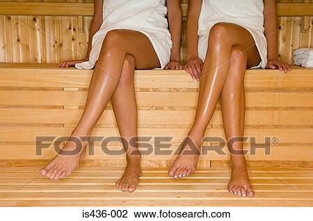Stock Image - Two women in sauna. Fotosearch
