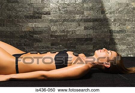 Woman having stone therapy View Large Photo Image Stock Image - Woman having stone therapy. Fotosearch