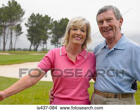 Couple on golf course View Large Photo Image Picture - Couple on golf course. Fotosearch