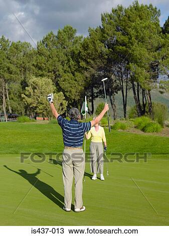Couple playing golf View Large Photo Image Stock Image - Couple playing golf. Fotosearch
