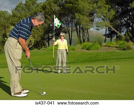Couple playing golf View Large Photo Image Stock Image - Couple playing golf. Fotosearch