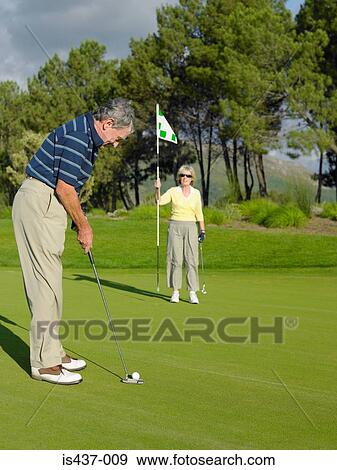 Couple playing golf View Large Photo Image Stock Photo - Couple playing golf. Fotosearch