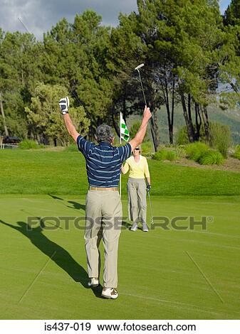 Couple playing golf View Large Photo Image Stock Photo - Couple playing golf. Fotosearch