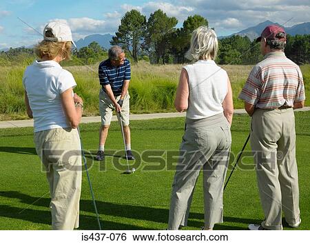 Friends playing golf View Large Photo Image Stock Photograph - Friends playing golf. Fotosearch