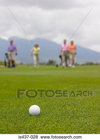 Golf ball and golfers View Large Photo Image Stock Photo - Golf ball and golfers. Fotosearch
