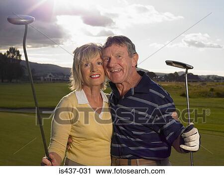Golfer couple View Large Photo Image Stock Image - Golfer couple. Fotosearch
