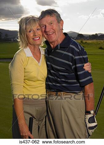 Golfer couple View Large Photo Image Stock Image - Golfer couple. Fotosearch