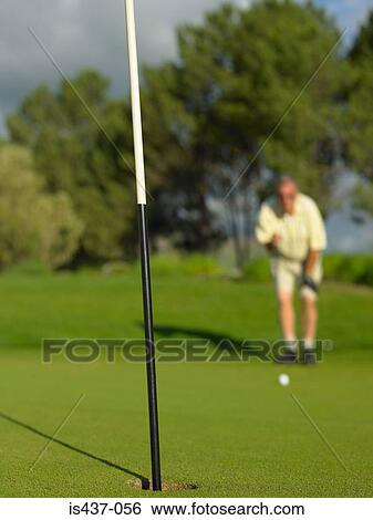 Golfer looking towards hole View Large Photo Image Stock Photograph - Golfer looking towards hole. Fotosearch