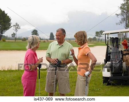 Golfers chatting View Large Photo Image Stock Photo - Golfers chatting. Fotosearch