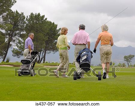 Stock Photo - Golfers walking. Fotosearch