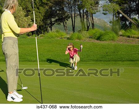 Women playing golf View Large Photo Image Stock Photo - Women playing golf. Fotosearch