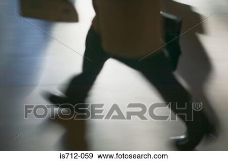 Commuter in a hurry View Large Photo Image Stock Photo - Commuter in a hurry. Fotosearch