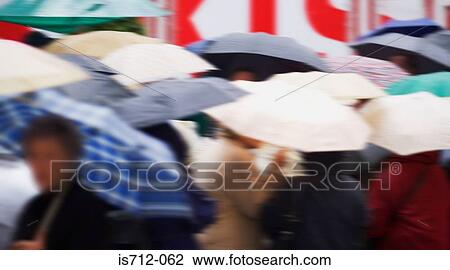 Crowd of people with umbrellas View Large Photo Image Stock Image - Crowd of people with umbrellas. Fotosearch