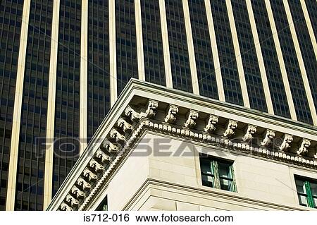 Stock Photograph - Modern skyscraper and historic building. Fotosearch
