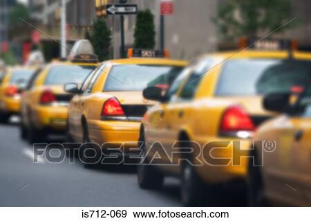 Queue of yellow taxi cabs View Large Photo Image Stock Photo - Queue of yellow taxi cabs. Fotosearch