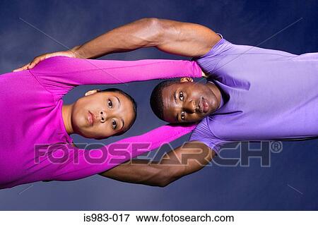 Athletes stretching together View Large Photo Image Stock Photo - Athletes stretching together. Fotosearch