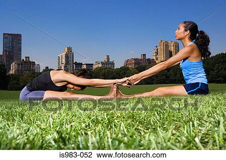 Female athletes stretching View Large Photo Image Stock Image - Female athletes stretching. Fotosearch
