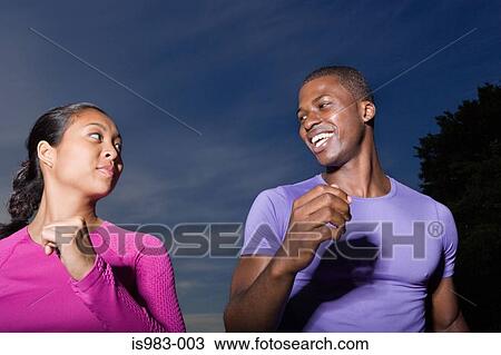 Stock Image - Man and woman jogging. Fotosearch
