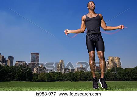 Man skipping in central park View Large Photo Image Stock Photo - Man skipping in central park. Fotosearch