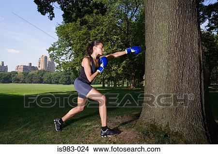Woman boxing in the park View Large Photo Image Picture - Woman boxing in the park. Fotosearch