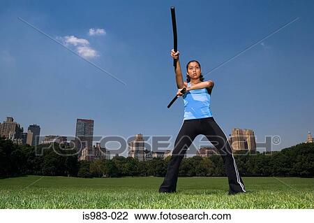Woman practicing escrima View Large Photo Image Stock Image - Woman practicing escrima. Fotosearch