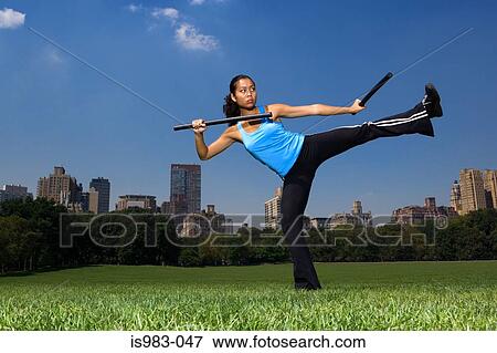 Stock Photo - Woman practicing escrima. Fotosearch