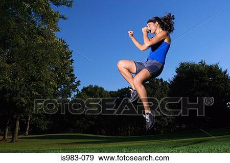 Woman practicing kick boxing View Large Photo Image Stock Photo - Woman practicing kick boxing. Fotosearch