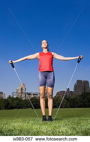Woman using resistance bands View Large Photo Image Stock Photo - Woman using resistance bands. Fotosearch