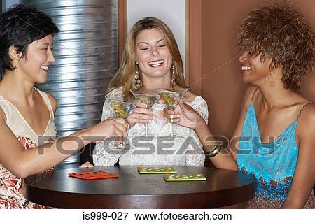 Female friends having cocktails View Large Photo Image Stock Photo - Female friends having cocktails. Fotosearch