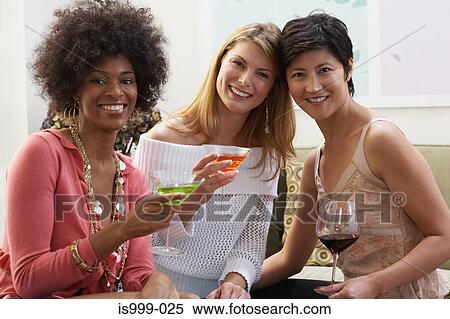 Female friends having cocktails View Large Photo Image Stock Photography - Female friends having cocktails. Fotosearch