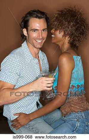 Flirtatious couple View Large Photo Image Stock Photo - Flirtatious couple. Fotosearch